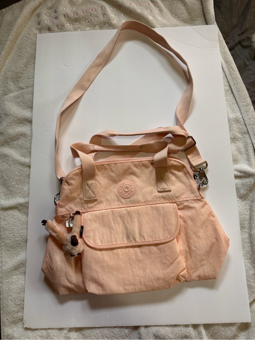 Kipling Peach Crossbody Bag with Plush Charm